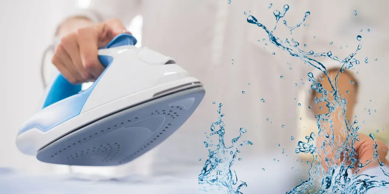 Ferro da stiro con spruzzo d'acqua. L'acqua per ferro da stiro aiuta a eliminare le pieghe dai tessuti.