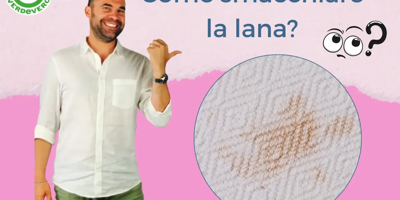 Uomo sorridente indica un ingrandimento di macchie gialle sulla lana bianca. Come smacchiare la lana?